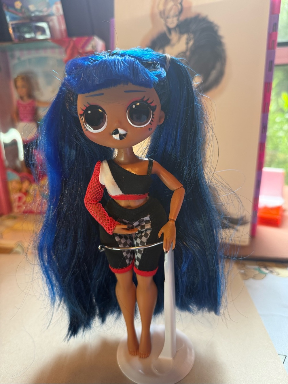 L.O.L. Doll with Vibrant Blue Hair and Black-Red Outfit